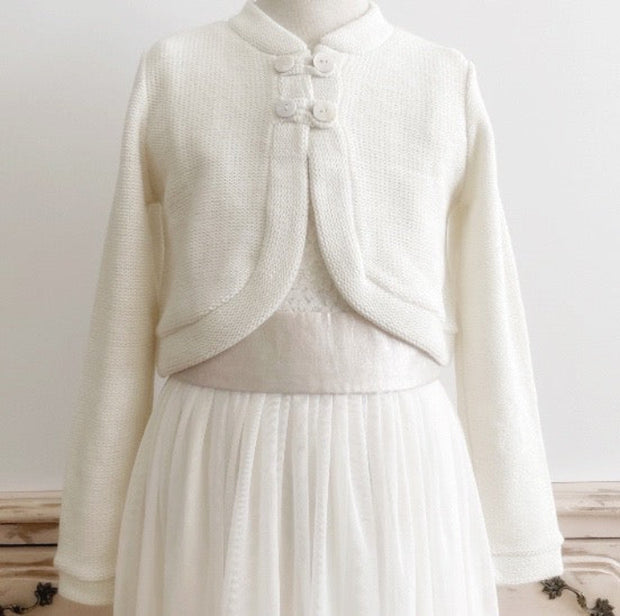 <a href="/products/bolero-de-nina-blanco-invierno" title="Bolero de niña color Barquillo">Boleros</a>